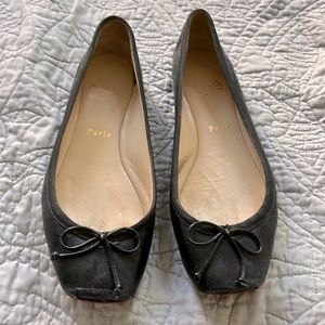 Louboutin ballet flats.